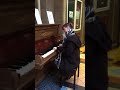 Playing the piano in the Byram Arcade