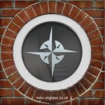 Compass rose round window