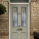 Etched toughened glass elegantly provides privacy for this door