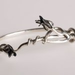 silver bangle with mild steel flowers