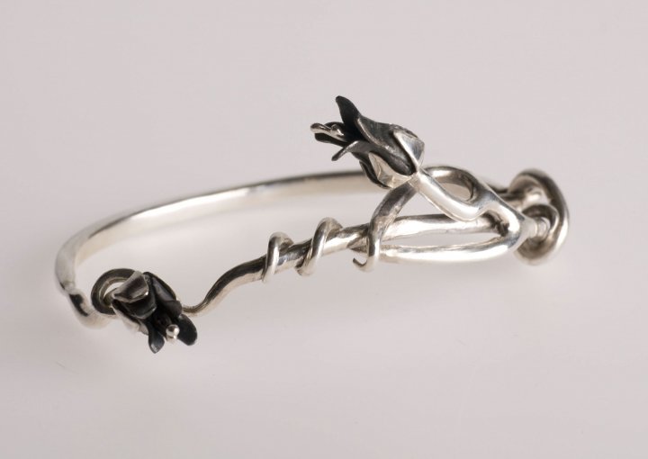 silver bangle with mild steel flowers