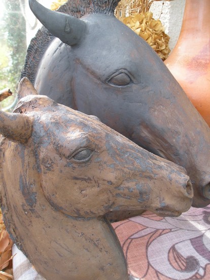 Two Matt copper horses
